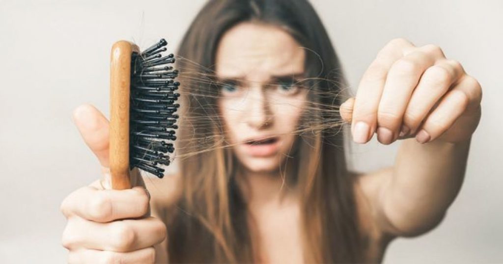 Woman suffering from Hair fall due to PCOS
